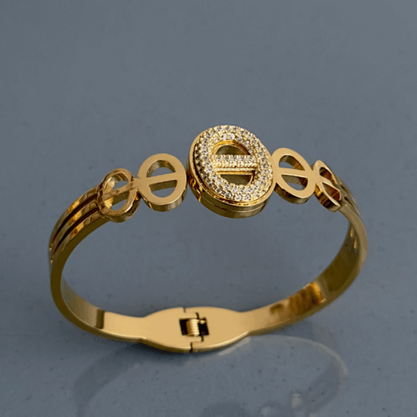 çelik gold elips taşlı kelepçe